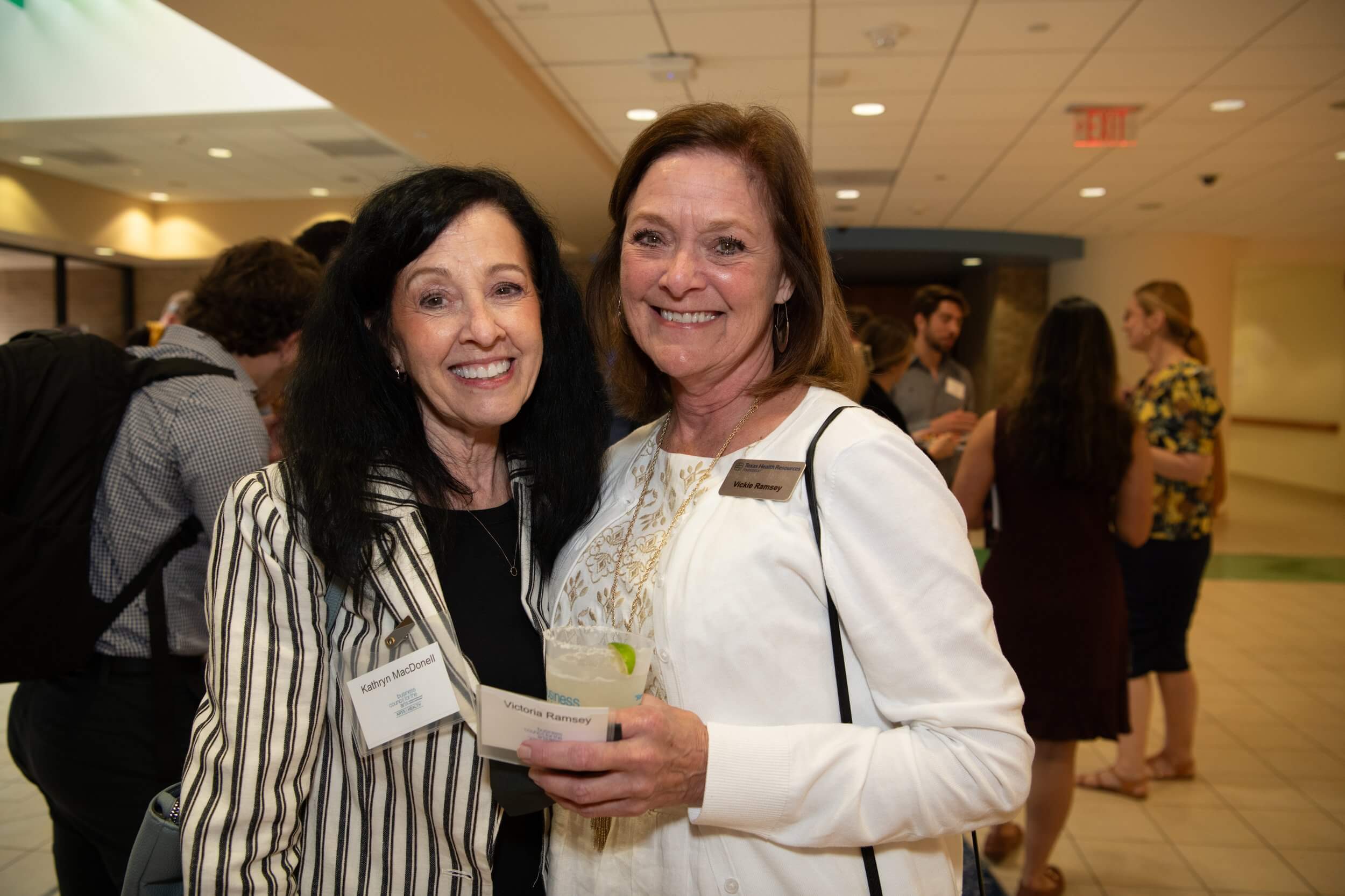 two women posing at event