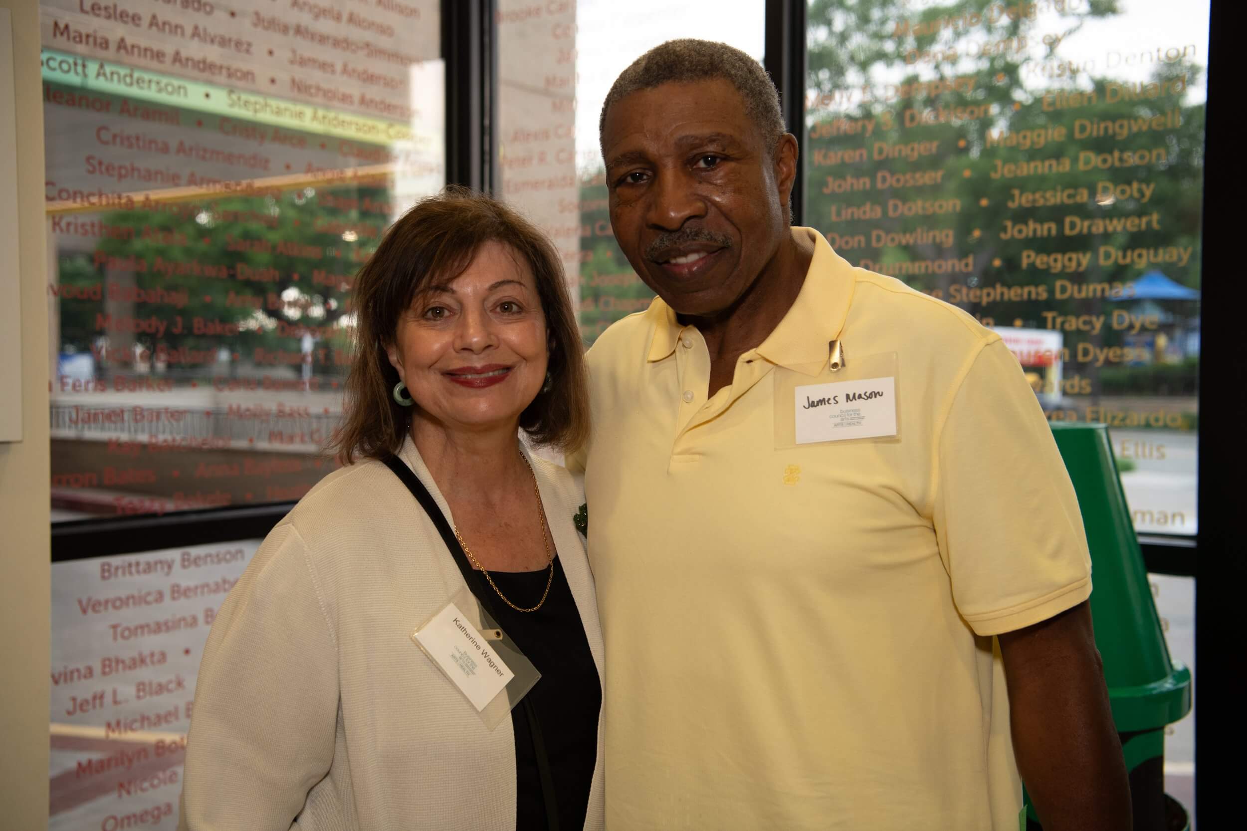 man and women posing at event