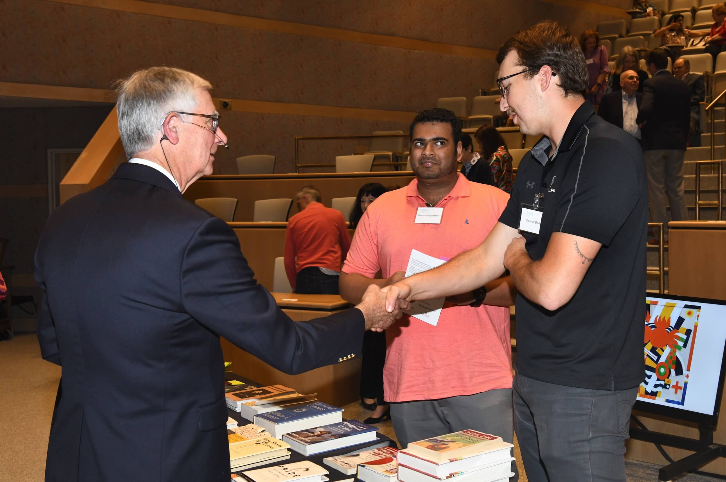 group of men shaking hands