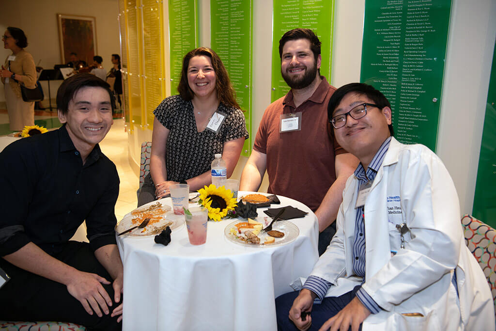 People smiling at Art and Health event