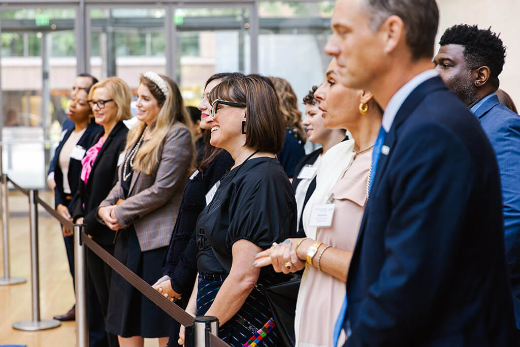 Group of people watching presenter