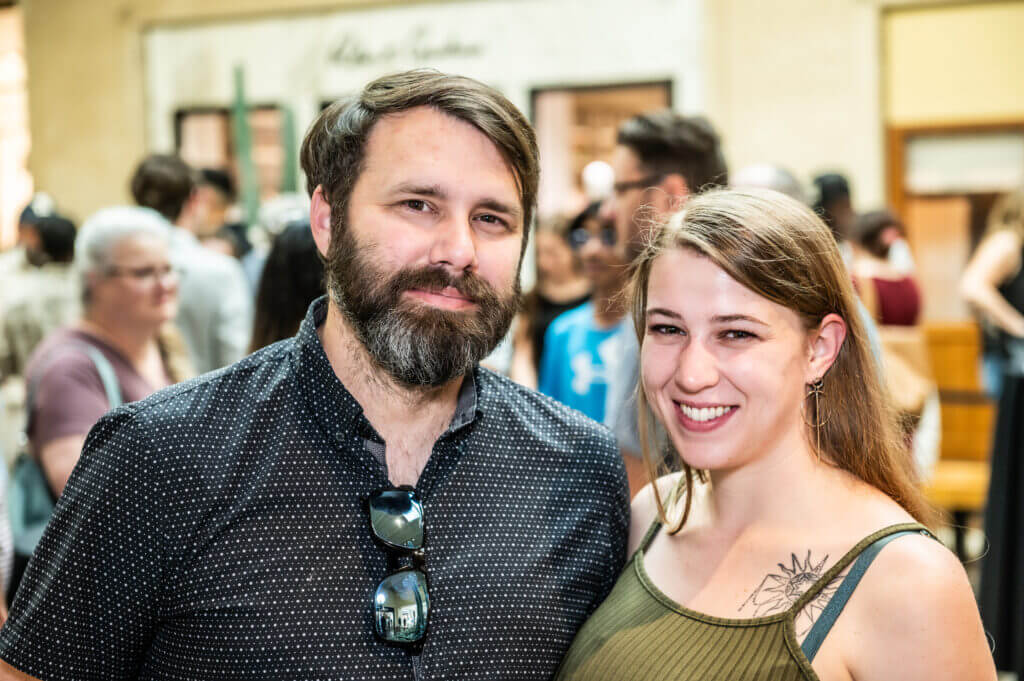 man and woman smiling