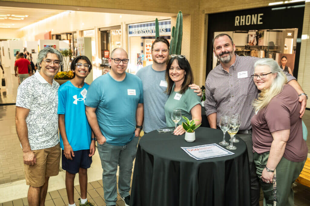 group of people smiling at table