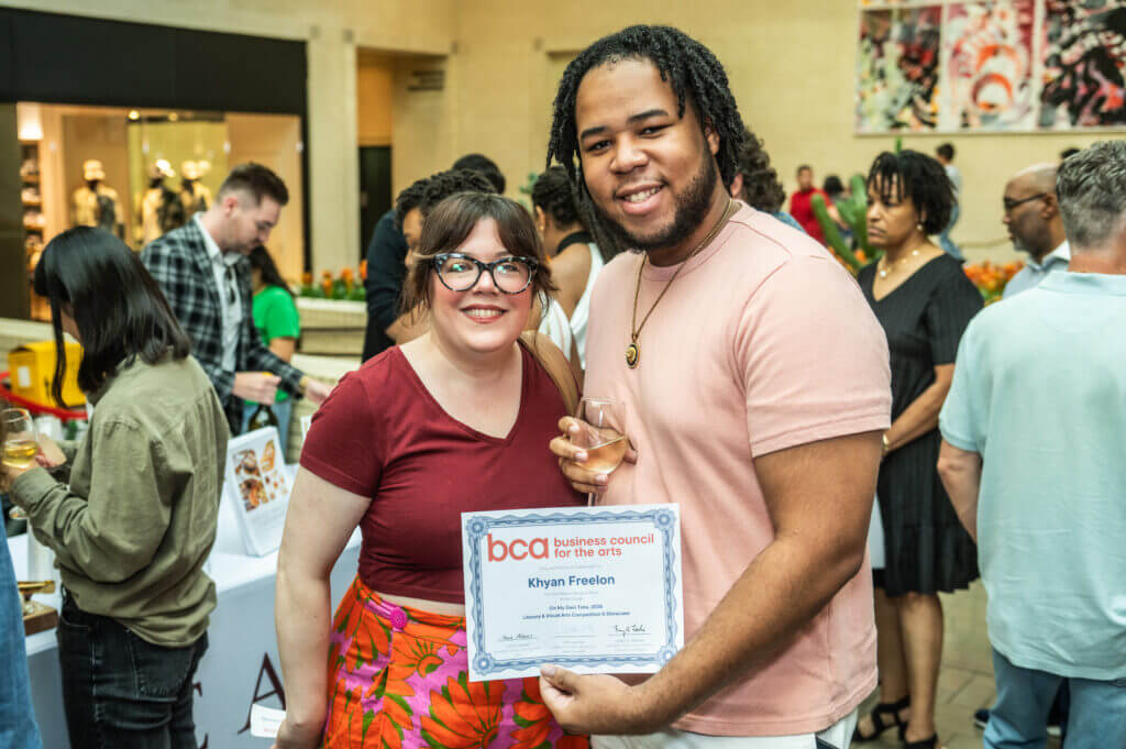 man and woman holding award