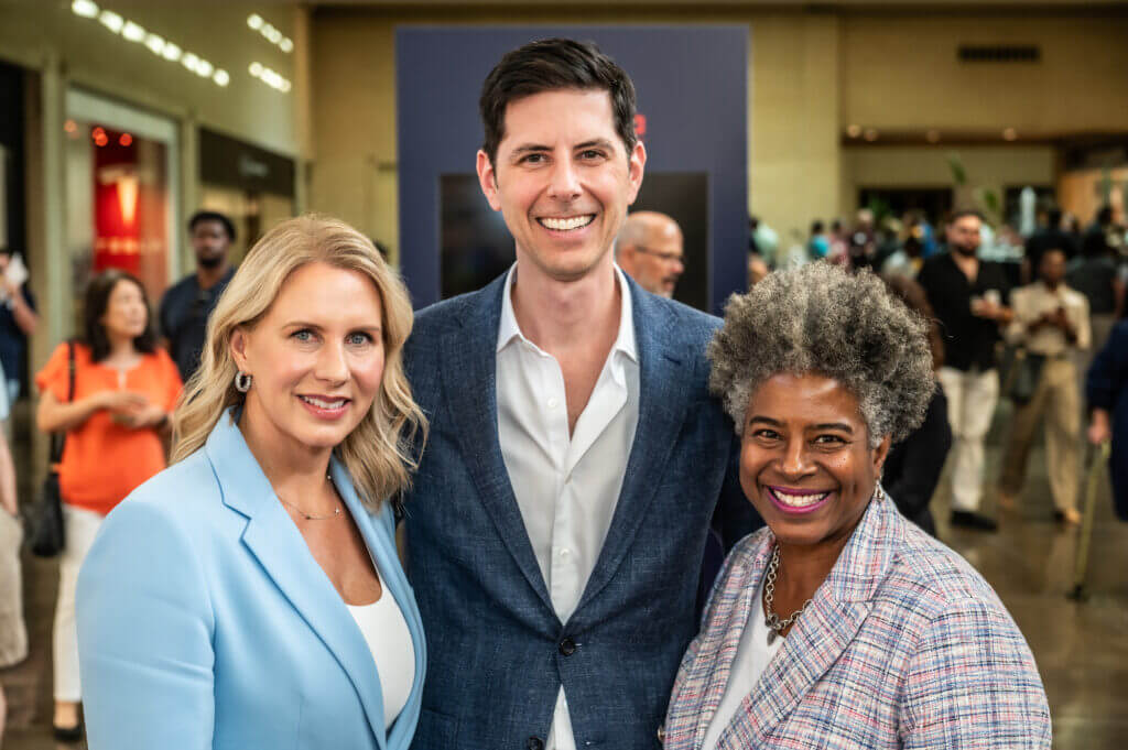 a man and two women posing