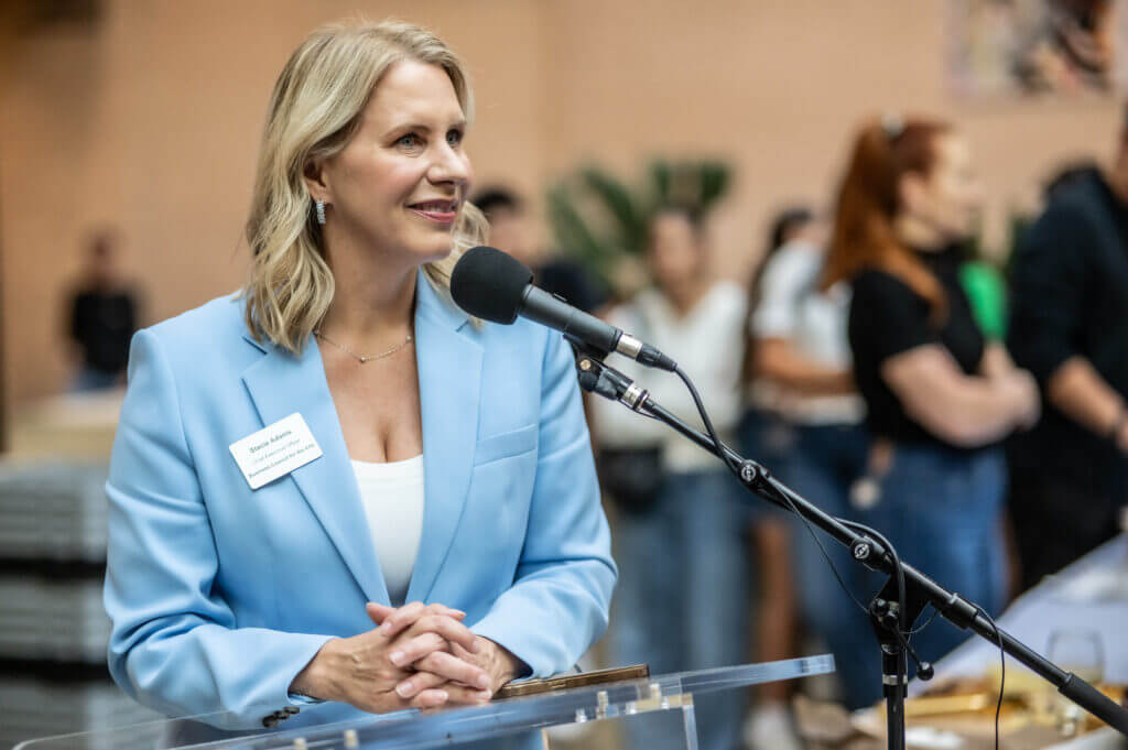 woman speaking into microphone