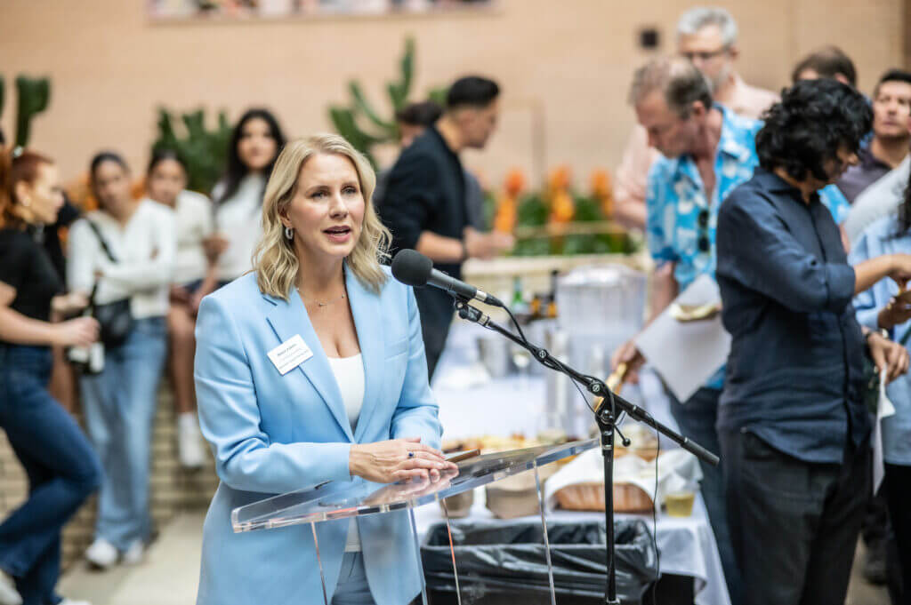 woman speaking into microphone