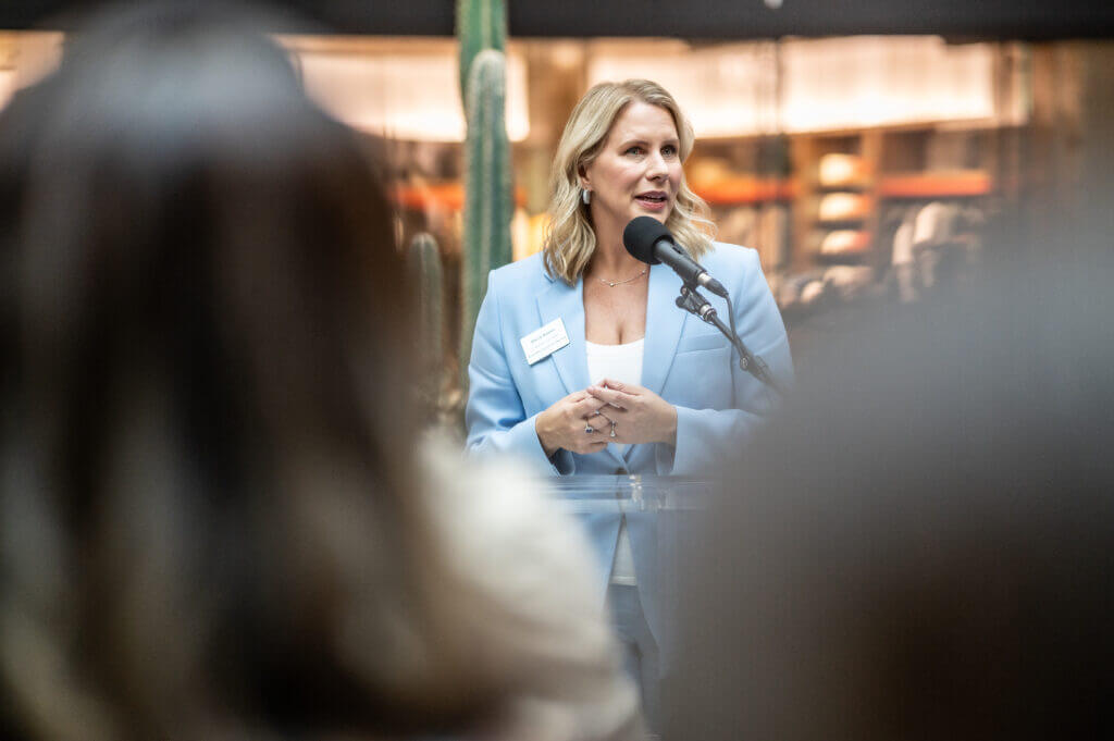 woman speaking into microphone