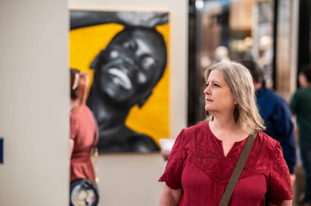 woman looking at art