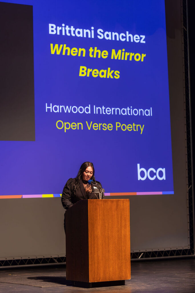 Brittani Sanchez (Harwood International) reads When the Mirror Breaks
